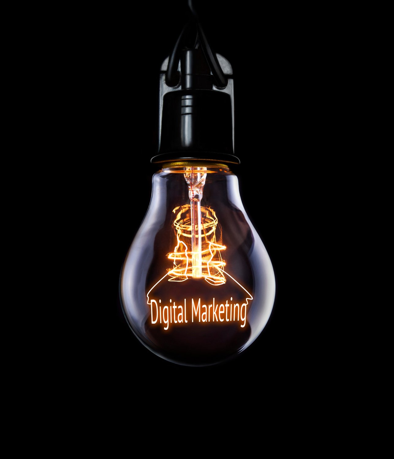 Hanging lightbulb with glowing Digital Marketing concept.